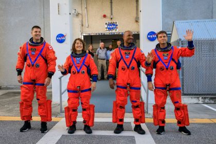 Artemis II crew members (from left) CSA (Canadian Space Agency) astronaut Jeremy Hansen, and NASA astronauts Christina Koch, Victor Glover, and Reid Wiseman walk out of Astronaut Crew Quarters inside the Neil Armstrong Operations and Checkout Building to the Artemis crew transportation vehicles prior to traveling to Launch Pad 39B as part of an integrated ground systems test at Kennedy Space Center in Florida on Sept. 20, 2023, to test the crew timeline for launch day. NASA/Kim Shiflett