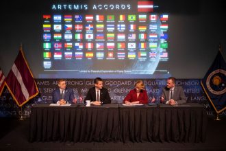 Latvia’s Minister for Education and Science Dace Melbārde, second from right, signs the Artemis Accords, as NASA Administrator Jared Isaacman, second from left, U.S. Under Secretary of State for Economic Affairs Jacob Helberg, left, and chargé d’affaires a.i. at the Embassy of the Republic of Latvia to the United States Jānis Beķeris, right, look on Monday, April 20, 2026, at the Mary W. Jackson NASA Headquarters building in Washington. NASA/Joel Kowsky