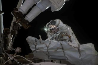 NASA astronaut Jessica Meir waves at the camera during a seven-hour, two-minute spacewalk outside the International Space Station on March 18, 2026. Credit: NASA